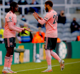 Sheffield Utd's Nigerian defender watches on from the bench as Newcastle make PL history