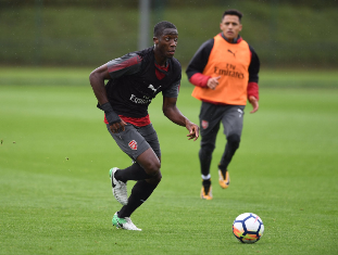 (Photo) Nigerian Starlet Olowu Training With Arsenal First-Team Star Sanchez 