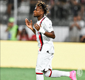 AC Milan forward Chukwueze watches on from the bench against favourite opponents Real Madrid 